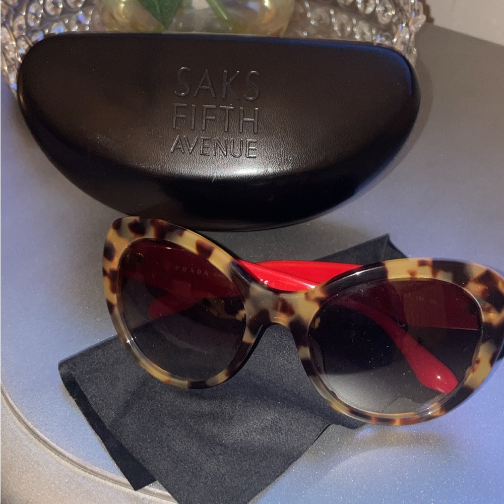 Prada women’s sunglasses. Excellent condition worn twice. Brown.